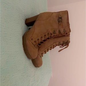 Tan heeled boots, they go perfect with jeans or shorts!